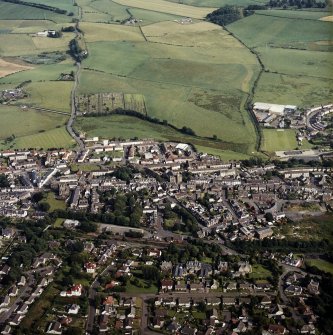 General oblique view centred on the town, taken from the NW.