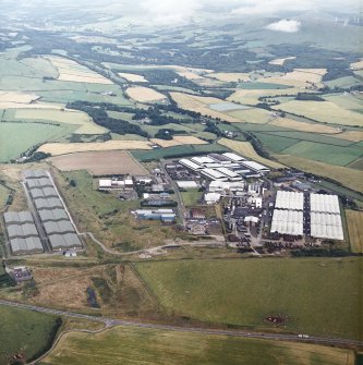 General oblique aerial view looking across the whisky distillery, taken from the WSW.