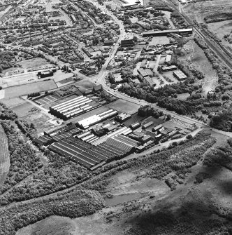 Oblique aerial view of Craigneuk St, Motherwell, centred on the Anderson Boyes Works, taken from the NNW.