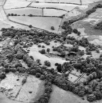 Formakin, oblique aerial view, taken from the NE, showing Formakin House in the bottom right-hand corner of the photograph, and Formakin Mill in the centre left.