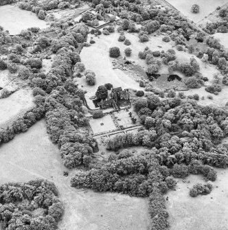 Formakin, oblique aerial view, taken from the N, showing Formakin House in the centre of the photograph, and Formakin Mill in the top centre.