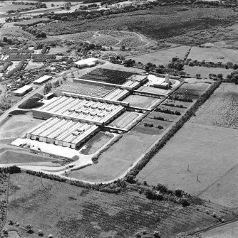 Oblique aerial view of Shottskirk Road centred on Cummins Engine Factory, taken from the NNE.