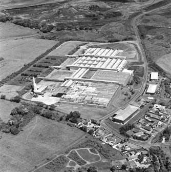 Oblique aerial view of Shottskirk Road centred on Cummins Engine Factory, taken from the SW.