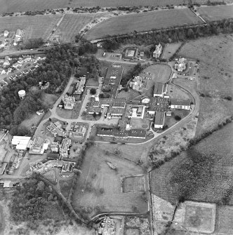 Oblique aerial view centred on the hospital, taken from the WNW.