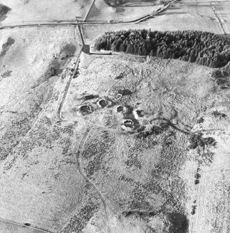 Oblique aerial view centred on the remains of the anti-aircraft battery with traces of the camp adjacent, taken from the ESE.