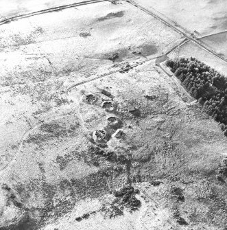 Oblique aerial view centred on the remains of the anti-aircraft battery with traces of the camp adjacent, taken from the NE.