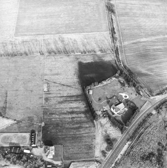 Oblique aerial view centred on the remains of an anti-aircraft battery, taken from the W.