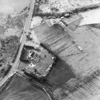 Oblique aerial view centred on the remains of an anti-aircraft battery, taken from the ESE.