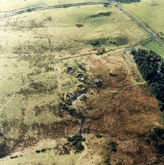 Oblique aerial view centred on the remains of the anti-aircraft battery with traces of the camp adjacent, taken from the NE.