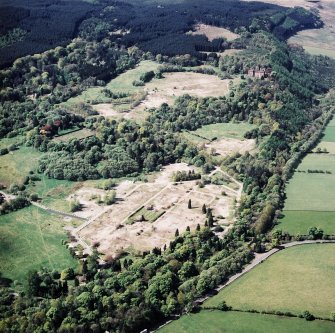 General oblique aerial view centred on the site of the hospital after the demolition of most buildings, taken from the NE.