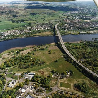 General oblique aerial view looking across the cottages and bridge towards Old Kilpatrick and Clydebank, taken from the WSW.