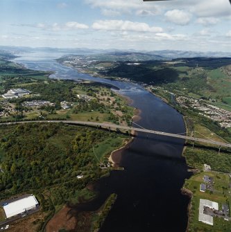 General oblique aerial view looking across the bridge and hospital along the River Clyde towards Dumbarton, Greenock and the Firth of Clyde, taken from the SE.