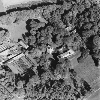 Oblique aerial view of the tower-house, country house, farmsteading and horsemill, taken from the SW.