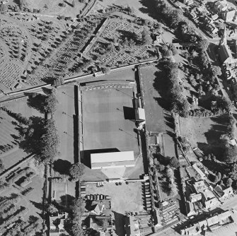 Oblique aerial view centred on the football ground, taken from the NW.