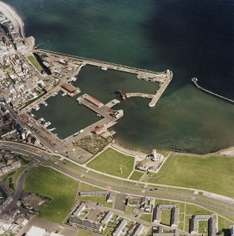 Oblique aerial view centred on the harbour and signal station, taken from the WNW.