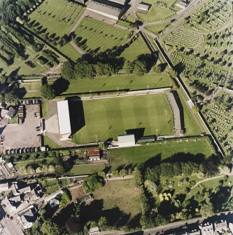 Oblique aerial view centred on the football ground, taken from the SW.