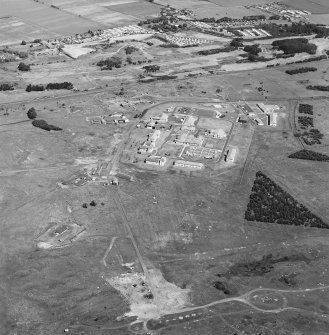 Oblique aerial view of Buddon Camp with the early 20th Century gun battery in the foreground.  Also visible is the modern main camp, 19th Century gunnery room and other ancilliary buildings.