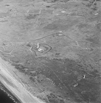 Oblique aerial view, centred on the lighthouses, with rifle ranges in the background, taken from the SE.
