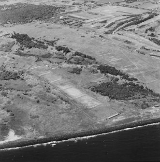 Oblique aerial view of the rifle ranges and training trench, taken from the SE.