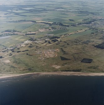 Oblique aerial view of the western part of the Barry Buddon Training Range.  Visible is the main camp with one small arms range and the early 20th Century gun battery.