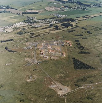 Oblique aerial view of Buddon Camp with the magazine and dismantled battery in the foreground, taken from the SSW.