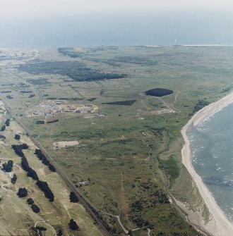 Oblique aerial view of the rifle ranges with Buddon Camp in the background, taken from the WNW.