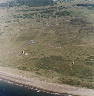Oblique aerial view, centred on the lighthouses with rifle ranges in the background, taken from the SSE.