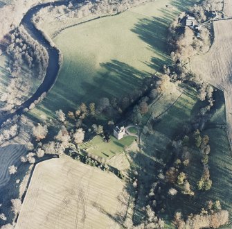 Oblique aerial view centred on the tower-house with watermill adjacent, taken from the WSW.