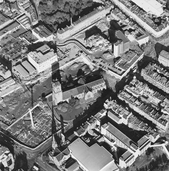 Oblique aerial view centred on the churches and adjacent construction, taken from the S.