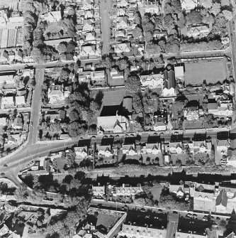 Oblique aerial view centred on the church, taken from the S.