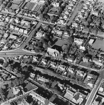 Oblique aerial view centred on the church, taken from the SSE.
