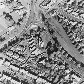 Oblique aerial view centred on the tower-house, taken from the SSW.