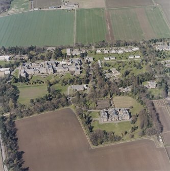 Oblique aerial view centred on the hospital and offices, taken from the S.