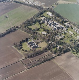 Oblique aerial view centred on the hospital and offices, taken from the E.