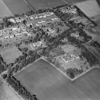 Oblique aerial view centred on the hospital and offices, taken from the SW.