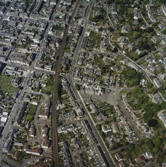 Oblique aerial view of Broughty Ferry centred on the school, taken from the E.