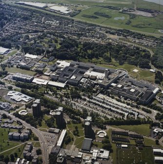 Oblique aerial view centred on the hospital, taken from the N.