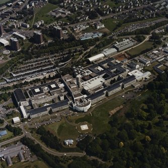 Oblique aerial view centred on the hospital, taken from the SW.