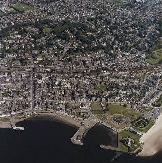 General oblique aerial view of Broughty Ferry centred on the school with the castle and harbour adjacent, taken from the SSW.