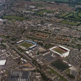 General oblique aerial view of Dundee centred on the football stadiums, taken from the SSE.