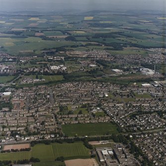 General oblique aerial view of the outskirts of Dundee and the school, taken from the S.