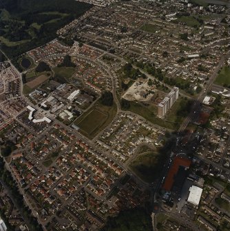 General oblique aerial view centred on the Ardler Estate, the schools, community centre and church, taken from the SE.