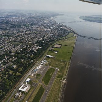 General oblique aerial view of Dundee, the bridges and the airport, taken from the WSW.
