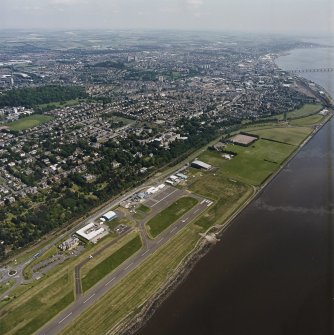 General oblique aerial view of Dundee and the airport, taken from the SW.