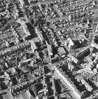 Oblique aerial view centred on the churches, Blackness Avenue and Perth Road, taken from the .