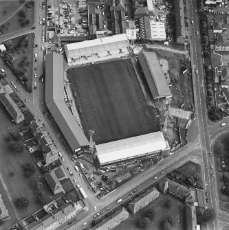 Dundee, Tannadice Street, Tannadice, oblique aerial view, taken from the NW, centred on the Dens Park football ground (under development).