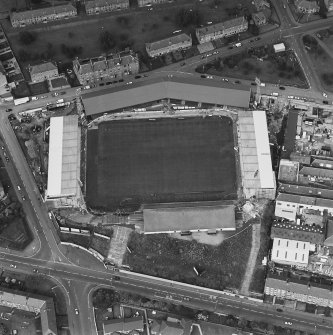 Dundee, Tannadice Street, Dens Park, oblique aerial view, taken from the SSW, centred on Dens Park football ground (under development).