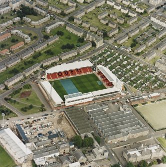 Dundee, Tannadice Street,Tannadice, oblique aerial view, taken from the SW, centred on Tannadice football ground, with Angus Jute Works visible in the bottom half of the photograph.