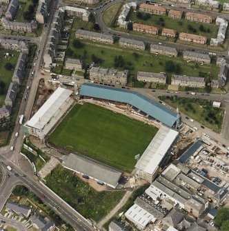 Dundee, Tannadice Street, Dens Park, oblique aerial view, taken from the S, centred on Dens Park football ground (under development).