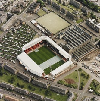 Dundee, Tannadice Street,Tannadice, oblique aerial view, taken from the NNW, centred on Tannadice football ground.  Angus Jute Works visible in the right-hand side of the photograph.